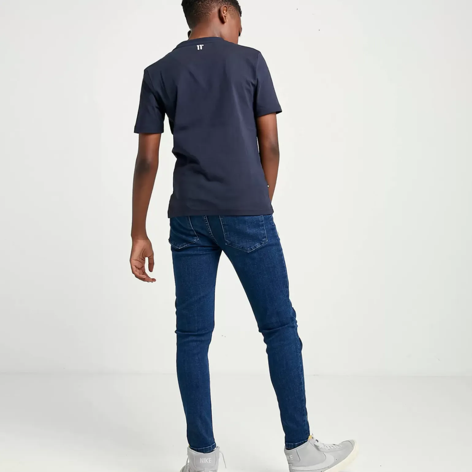 11 Degrees Junior Sustainable Distressed Skinny Jeans – Mid Blue Wash