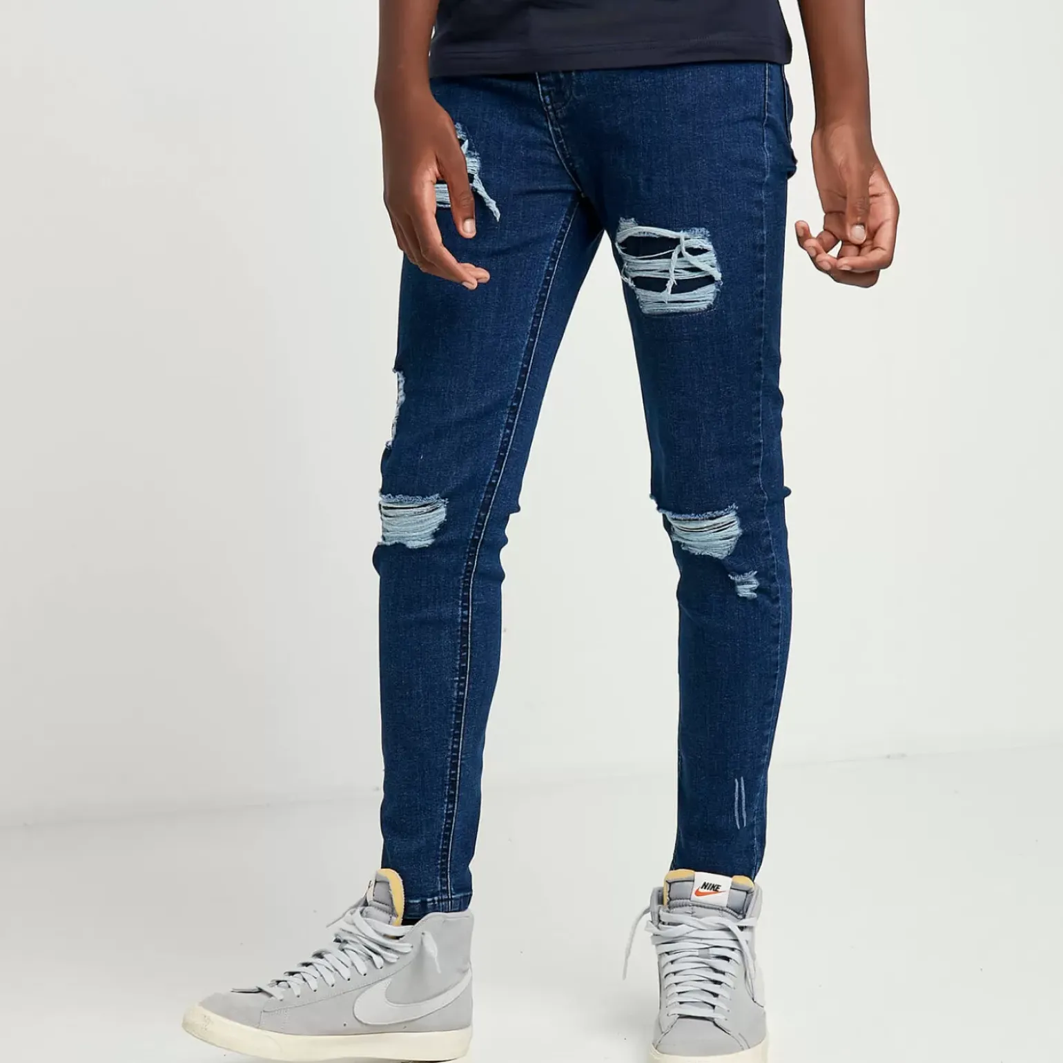 11 Degrees Junior Sustainable Distressed Skinny Jeans – Mid Blue Wash