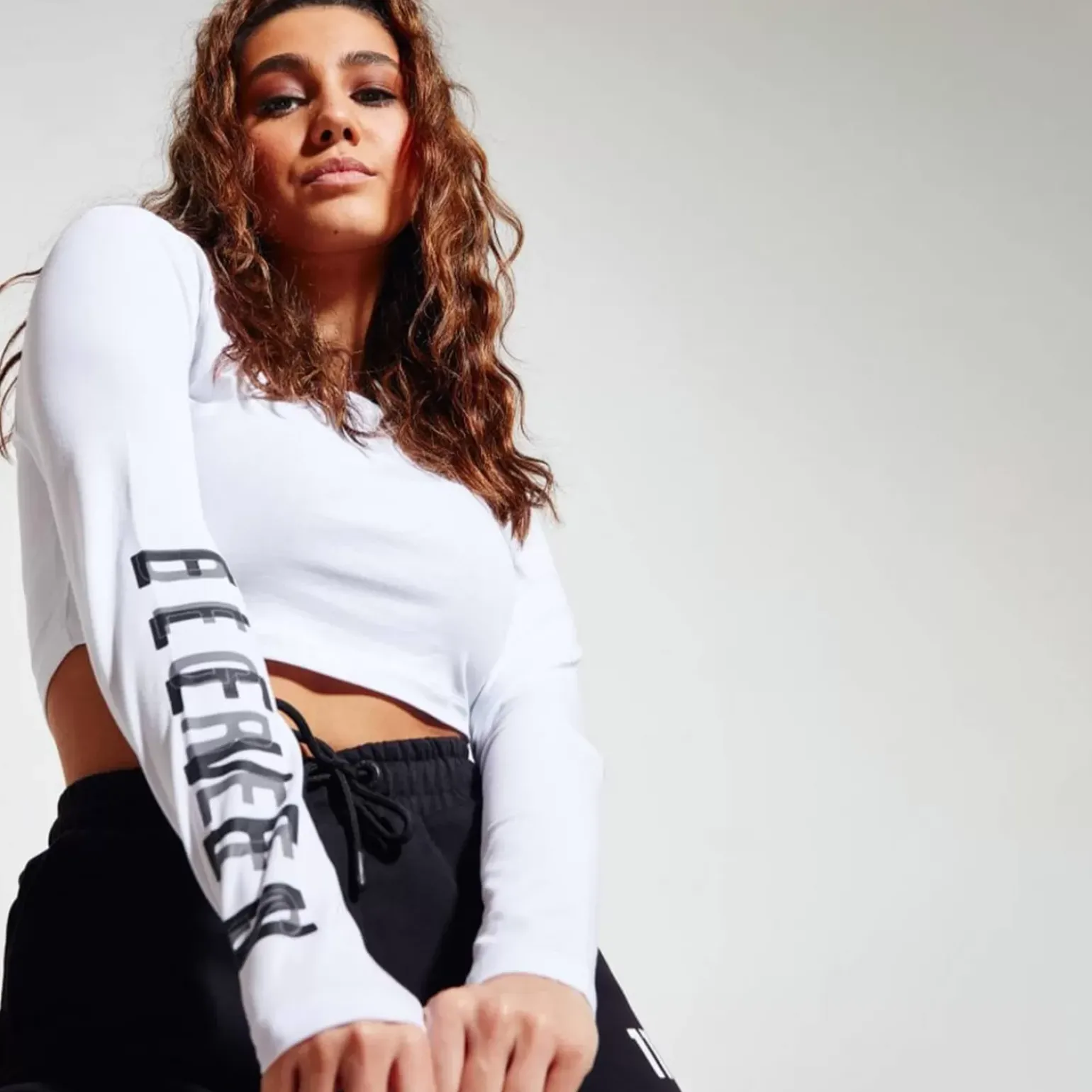 11 Degrees Womens Cropped Long Sleeve Graphic T-Shirt – White